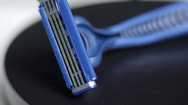disposable razor close up on turntable. disposable razor blades in macro