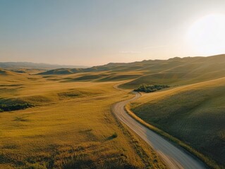 Winding road through golden hills at sunset capturing a serene landscape view