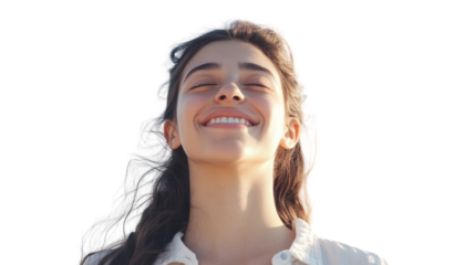 A joyful young woman with long hair smiling brightly against a clear background, exuding happiness and positivity, perfect for wellness and lifestyle themes.