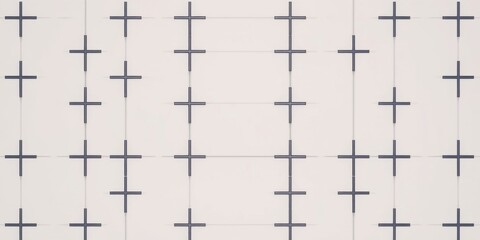 A white surface with evenly spaced black crosses, creating a grid pattern of intersecting lines