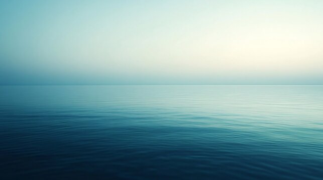 Tranquil Ocean Horizon Under a Clear Blue Sky at Dawn