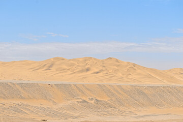 barren desert landscape contrasted on blue sky