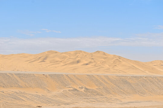 barren desert landscape contrasted on blue sky
