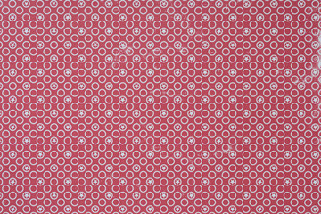 red paper with circle or dot pattern