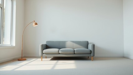 Minimalist living room with a grey sofa, floor lamp, and a large window letting in natural light.