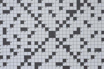 decorative scrapbooking paper with crossword puzzle grid