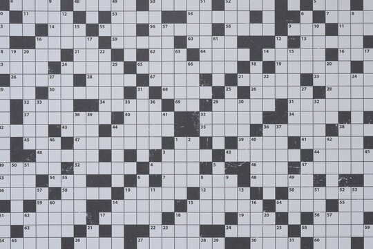 decorative scrapbooking paper with crossword puzzle grid