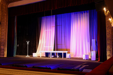 Different furniture and other decorations on stage in theatre