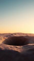 Naklejka premium A deep hole in the ground under a vast sky at sunset.