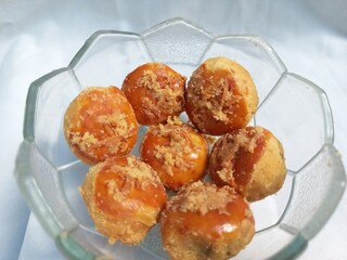 Pineapple tart cookies in a transparent bowl. Food photography for advertisement and culinary. Isolated on white background. Close up. Space for text.