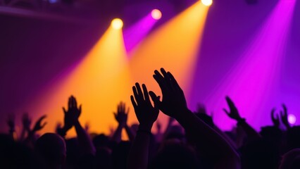 Hands in the air, people who are praising God and Jesus at a church service with worship band in the background,