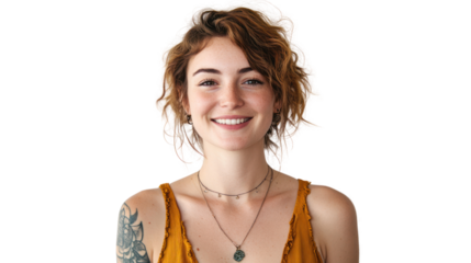 A young woman with curly hair smiles brightly, showcasing her tattoos and a warm personality. She embodies confidence and joy, perfect for lifestyle imagery.
