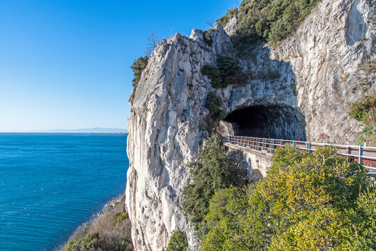 Trieste (Italy): panoramic coast road over the sea known as Strada Costiera, passing through a tunnel in the rock