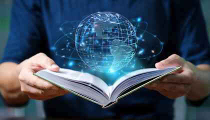 Student studies gravitational forces with an open book and a digital globe display