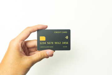 Hand of young men is holding black mockup credit cart with isolated white background