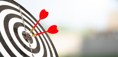 red darts on target with blur background