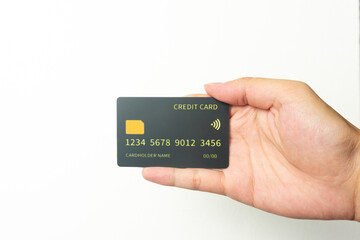 Hand of young men is holding black mockup credit cart with isolated white background