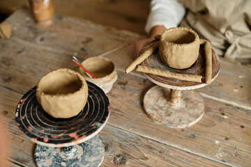 shaping clay in a pottery class, fostering creativity and connection.