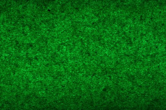 Green abstract texture with fibers through a green light