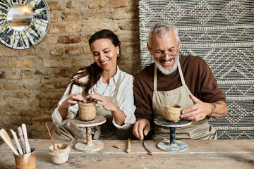 A couple shares quality time in a pottery class, embracing creativity and connection.