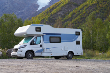 Autotravel to Prielbrus in autumn. Camper on a specially equipped site in a mountain gorge surrounded by picturesque nature.