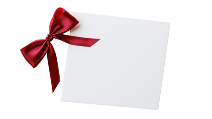 Blank card with red ribbon bow for special occasions. Isolated on white background.