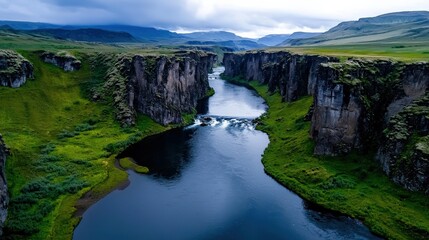 A wide-angle view of a majestic river flowing through a rugged canyon, framed by dramatic cliffs