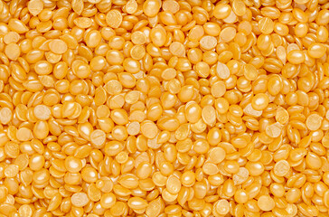 Macro background photography of cosmetics hard wax beads, waxing, hair removal, depilation, spa salon, beauty procedure, advertisement