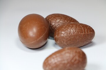 close-up of various unwrapped chocolate Easter eggs