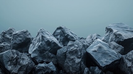 Obraz premium The dark rocky terrain, with its coarse and rugged stone textures, contrasts starkly against the soft gradient background.