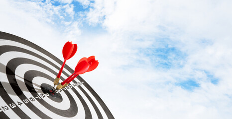 Blue sky with dart on target background