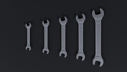 Five wrenches arranged in ascending order of size against a black background. Ideal for illustrating engineering, mechanics, industrial themes. Visual representation of range, scale, or progression.