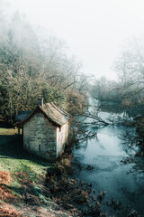 Old boathouse by a lake in Winter