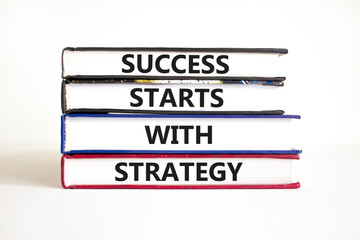 Success starts with strategy symbol. Concept words Success starts with strategy on beautiful books....
