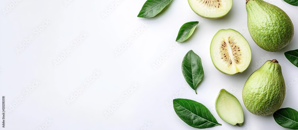Poster fresh avocados with green leaves arranged on a white background with copy space for text.