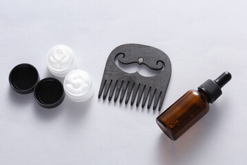 Men's beard grooming accessories on white background