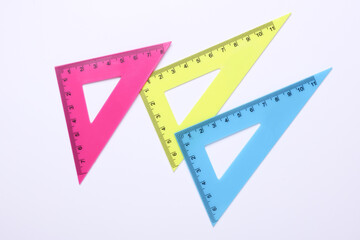 Rulers triangles on white background. Top view