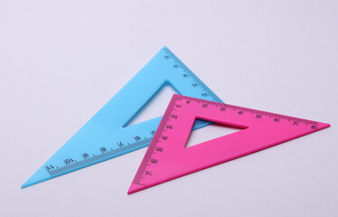 Rulers triangles on a white background