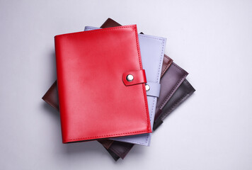 Leather organizers for important papers and documents on a white background