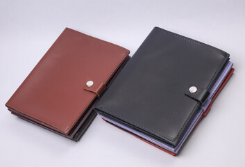 Leather document organizer folders on gray background