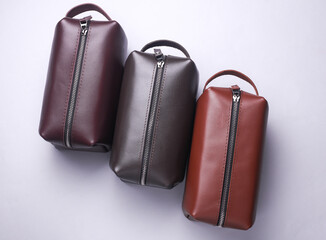 Leather cosmetic bags organizers on white background