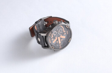 Stylish men's wristwatch on white background