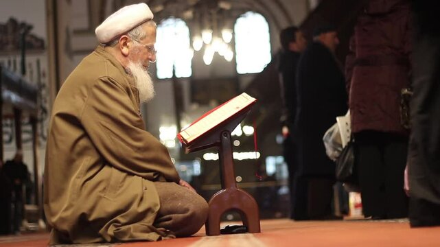 muslim reading quran in mosque