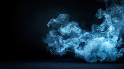 Ethereal Blue Smoke Swirling Against Dark Background for Creative and Artistic Concepts