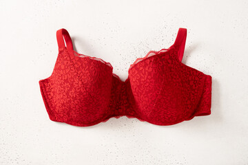 Lace sexy red womens underwear on white background. Love. Women's bra, erotic clothes. View from...
