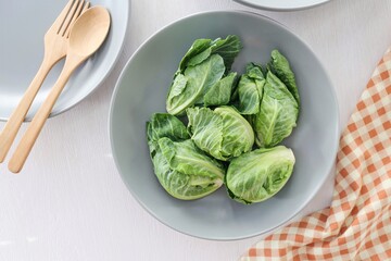 Brussels Sprouts in grey plate on white background