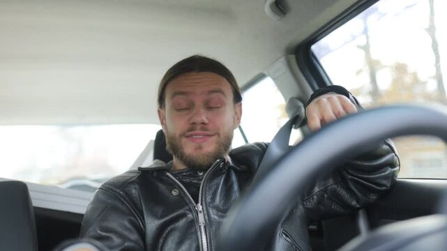 an emotional man driving a car