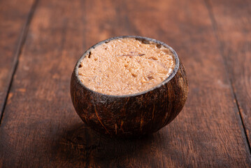 Coconut candy (cocada), Delicious cocada made in Brazil and presented inside the coconut shell, selective focus.