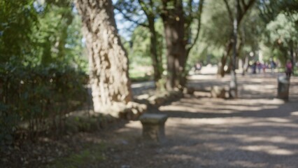 Blurred view of villa borghese gardens in rome showcases the defocused blend of lush greenery and serene outdoor ambiance under the italian sun.