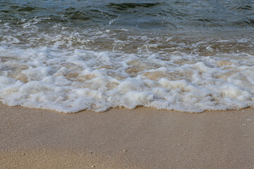 Sea wave rolling on the coast rocks